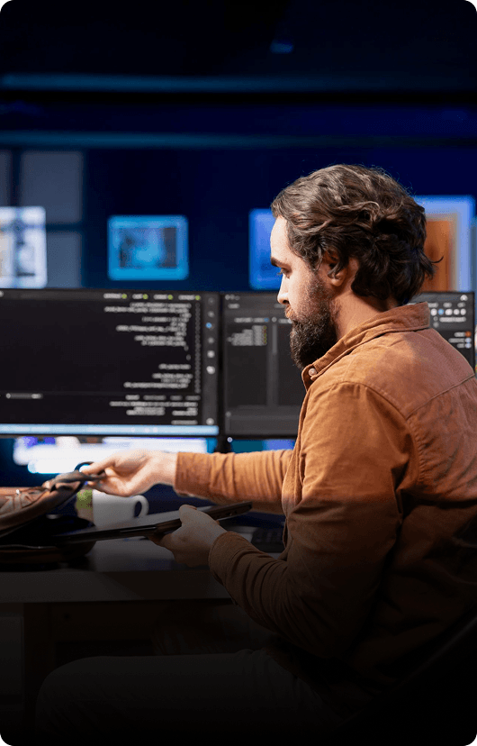 Expert developer at multi-monitor workstation